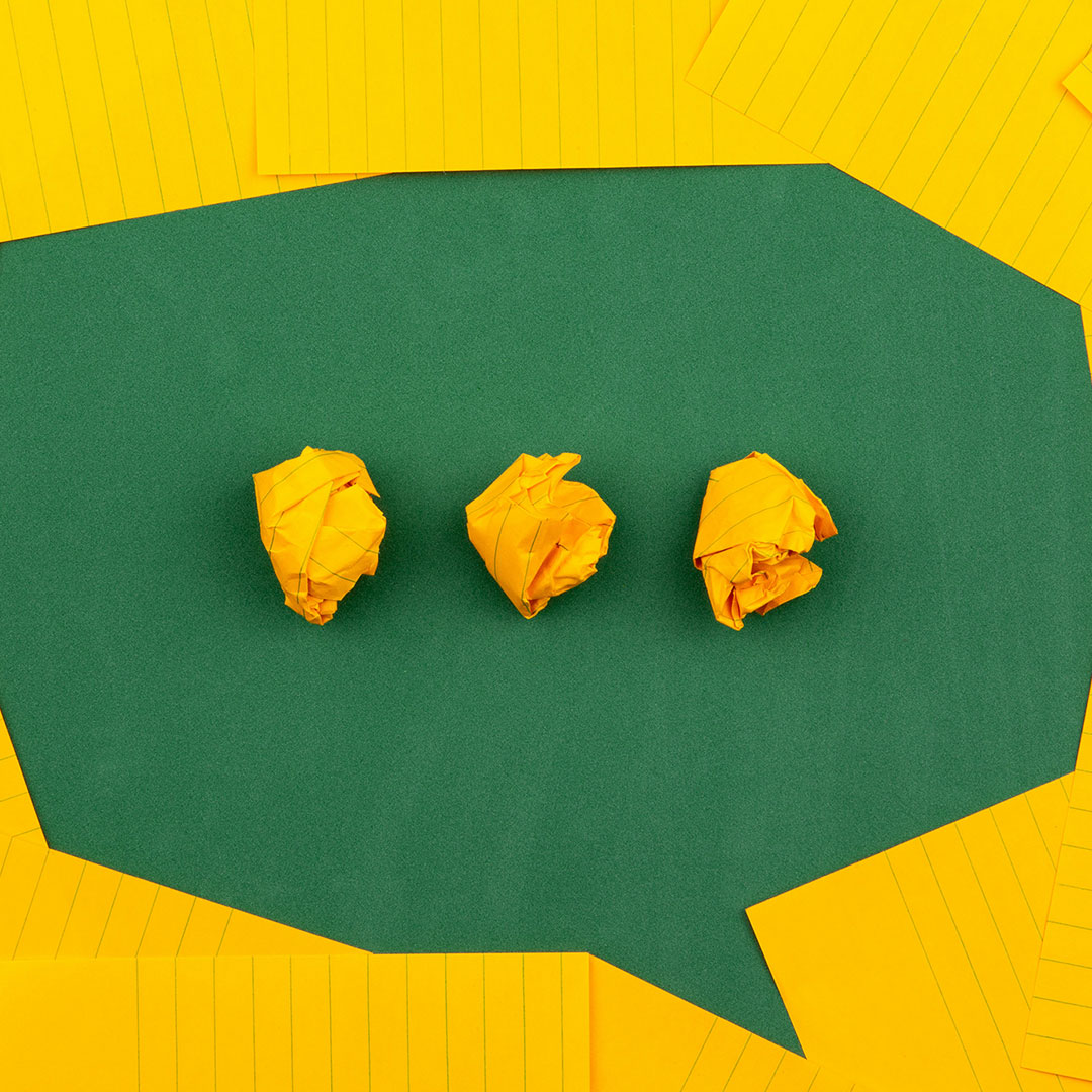 image of yellow papers forming a speech bubble. 